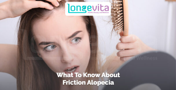 woman examining her scalp while holding a hairbrush with text about friction alopecia