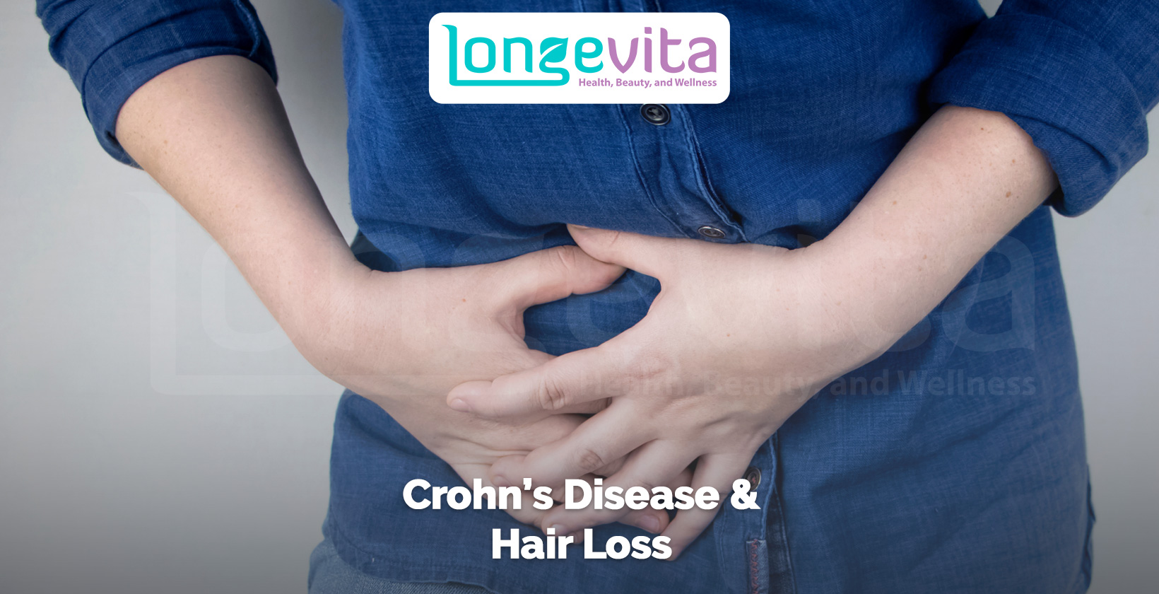 close-up of a person holding their stomach in discomfort, symbolizing Crohn’s disease and its link to hair loss