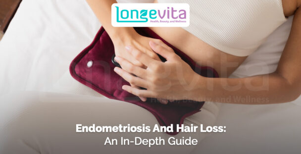 woman holding heating pad against lower abdomen for endometriosis pain relief