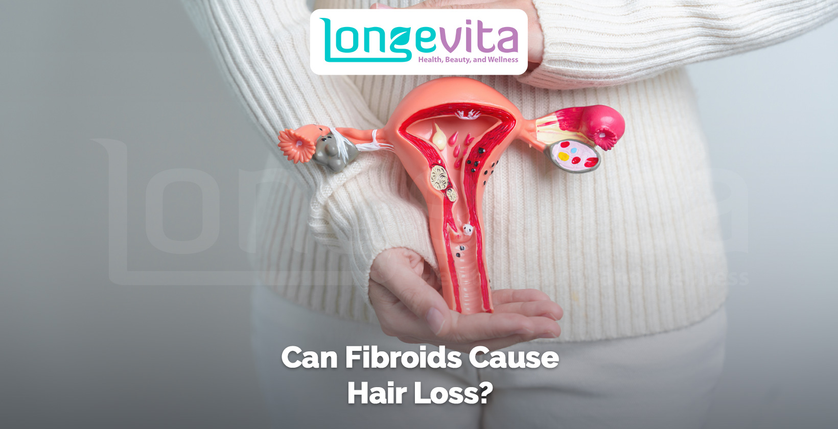 woman holding anatomical uterus model representing fibroids and hormonal changes