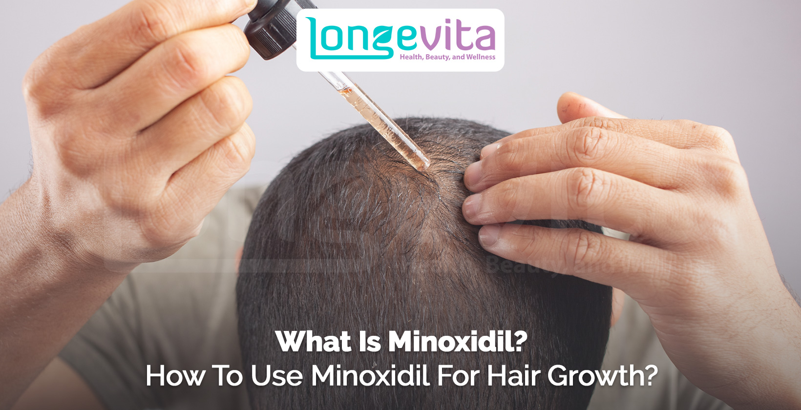 close-up of a person applying minoxidil with a dropper on scalp