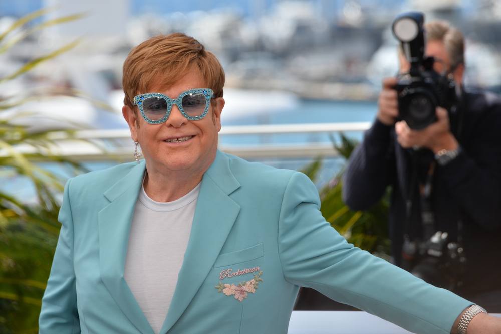 Elton John wearing wig