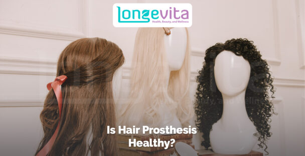 three mannequin heads displaying wigs and hair prostheses