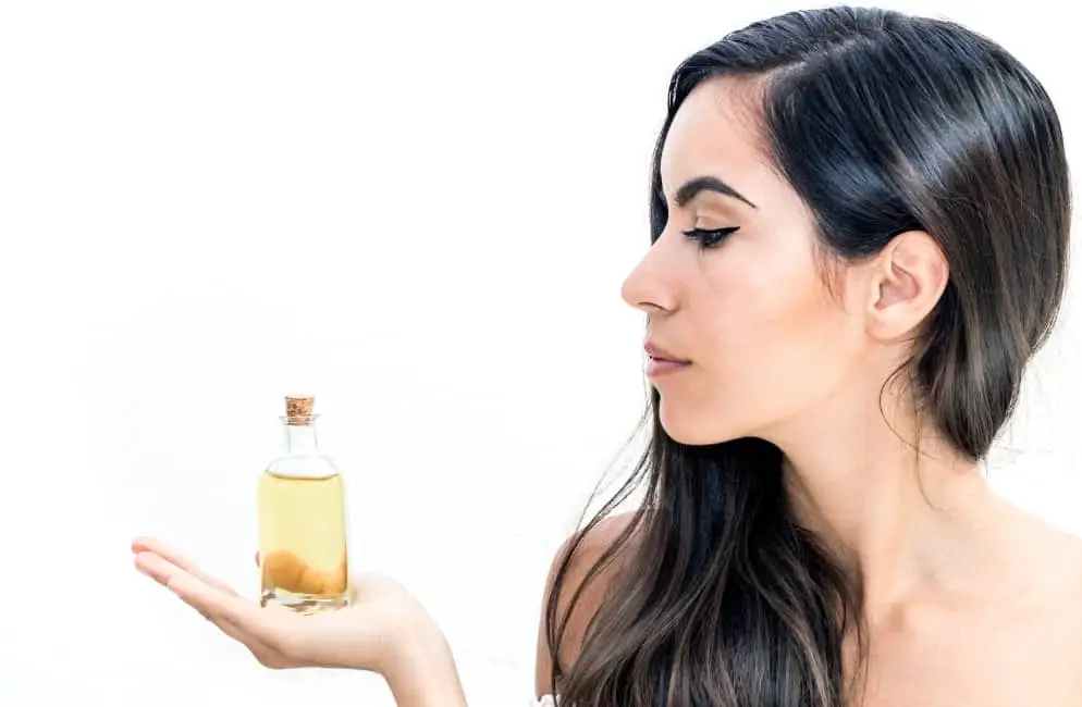 woman holding serum bottle