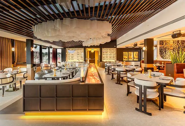 upscale restaurant interior at Movenpick Hotel with stylish seating and ambient lighting