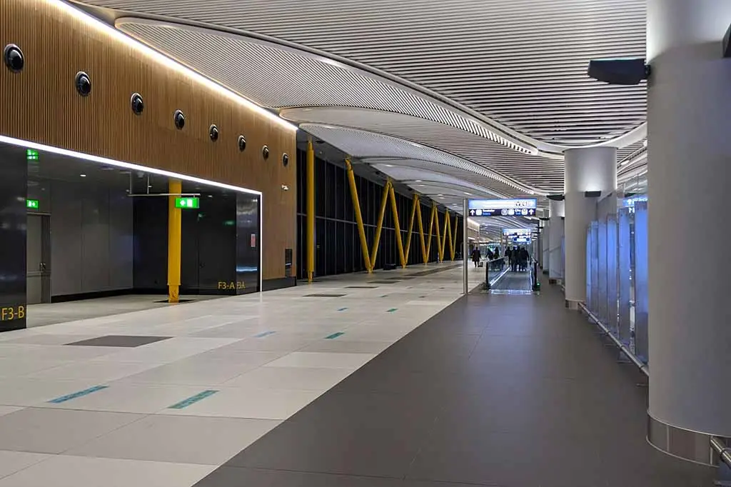 empty corridor inside Istanbul Airport terminal with modern design and signage