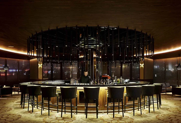 stylish circular bar with bartender inside Pullman Istanbul Airport Hotel
